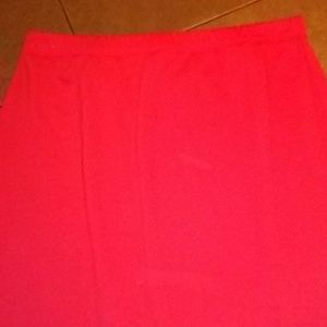 Long red skirt with slits up each side